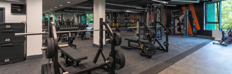 A view of the gym at Harrogate Leisure and Wellbeing Hub including weights and workout benches