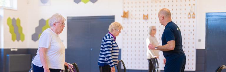 A group of women taking part in a balance class at Fairfax Community Hub