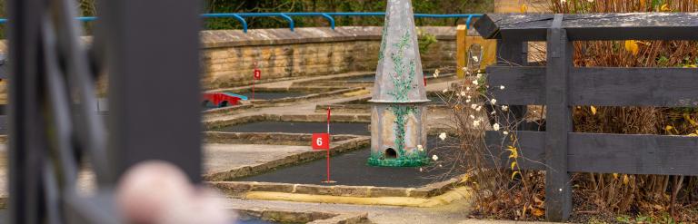 One of the holes on Richmond Leisure and Wellbeing Hub mini golf course with some golf balls in the foreground.