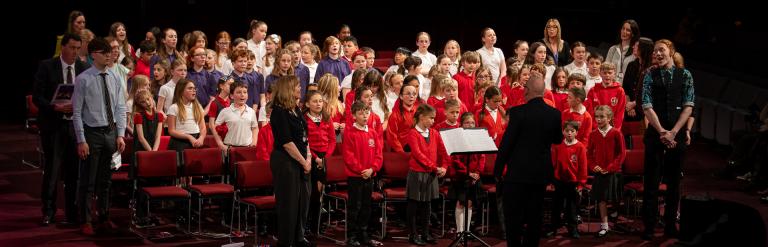 Children from Saltergate School in Harrogate standing singing