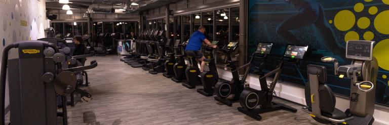 A view of the gym equipment at Northallerton Leisure and Wellbeing Hub, a man is using a treadmill and another man is working out