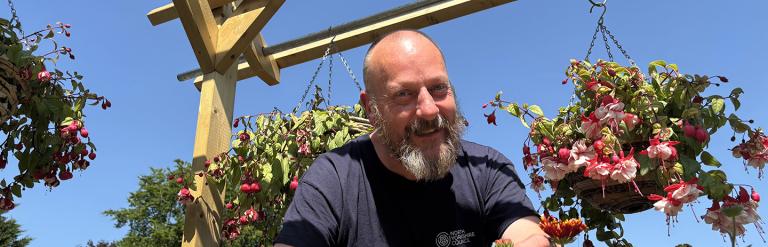 Our lead horticultural grower, Darrell Gardner cutting some plants