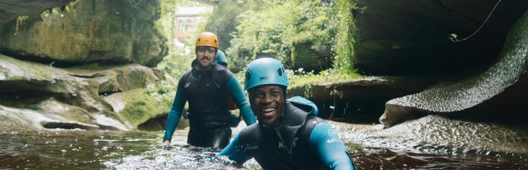 Two people exploring How Stean Gorge in wetsuits. Credit Tom Arber and Visit North Yorkshire