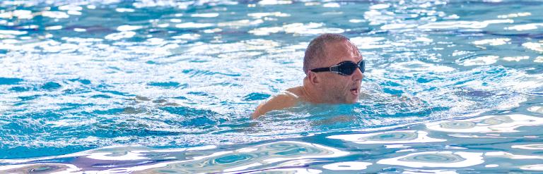 A man in googles swimming in the pool at Skipton Leisure and Wellbeing Hub