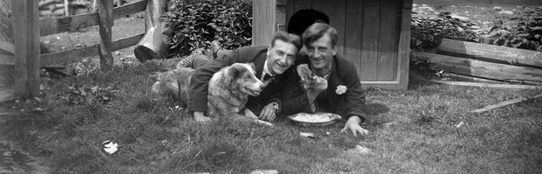Two men and their dog in 1920. From a collection of photographs of the Dunsforth area by local amateur photographer Louisa Kruckenberg.