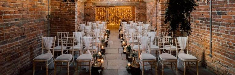 Inside Howard Court with chairs, candles and decorations ready for wedding