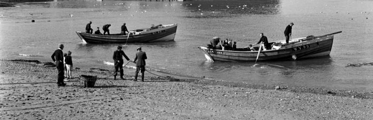 Black and white photo of adults fishing at Cowbar Nab during the 20th century. From the Bertram Unné photographic collection.
