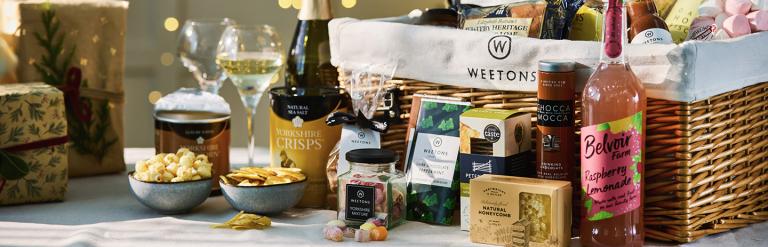 Weetons Family Deluxe hamper products arranged on a table.